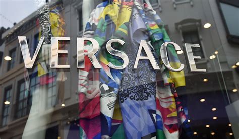 mk buys out versace